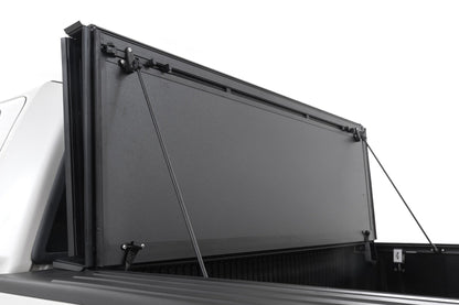 Rough Country 49214550 Hard Tri-Fold Flip Up Bed Cover | 5'7" Bed | Ford F-150 2WD/4WD (2004-2014)