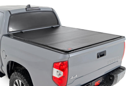 Rough Country 49414551 Hard Tri-Fold Flip Up Bed Cover | 5'7" Bed | Toyota Tundra 2WD/4WD (07-21)