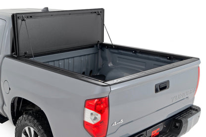 Rough Country 49414551 Hard Tri-Fold Flip Up Bed Cover | 5'7" Bed | Toyota Tundra 2WD/4WD (07-21)