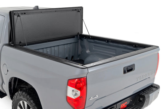 Rough Country 49414551 Hard Tri-Fold Flip Up Bed Cover | 5'7" Bed | Toyota Tundra 2WD/4WD (07-21)