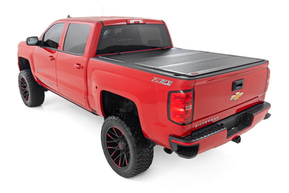 Rough Country 49119651 Hard Tri-Fold Flip Up Bed Cover | 6'7" Bed | Rail Cap | Chevy/GMC 1500/2500HD/3500HD (14-19)