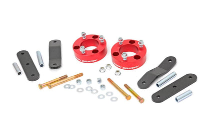 Rough Country 867RED 2.5 Inch Leveling Kit | Red Spacers | Nissan Frontier (05-25)/Xterra (05-15)